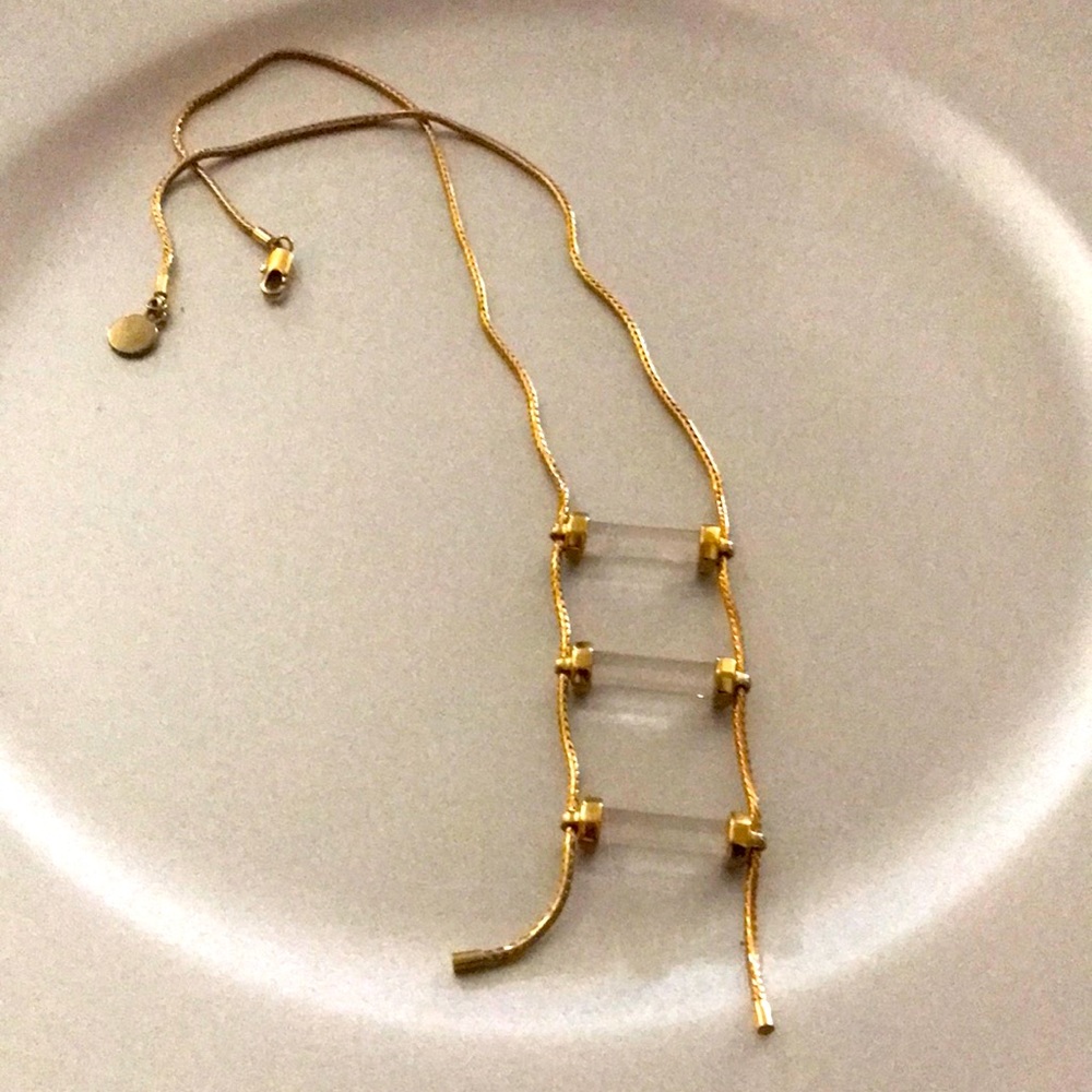 Golden necklace with three quartz